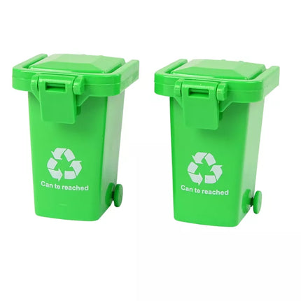 Žalias šiukšliavežis su judančiu konteineriu ir šviečiančiais ratais