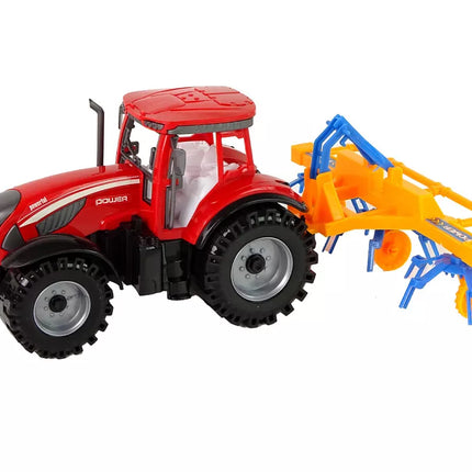 Raudonas traktorius su grėbliu, frikcinis variklis
