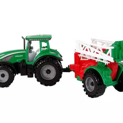 Žalias ūkinis traktorius su raudonu ir žaliu purkštuvu, varomas frikciniu būdu