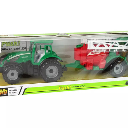 Žalias ūkinis traktorius su raudonu ir žaliu purkštuvu, varomas frikciniu būdu