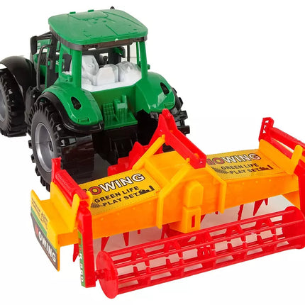 Žalias traktorius su oranžiniu kultivatoriumi vaikams