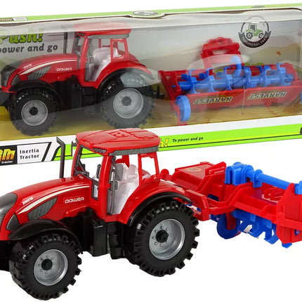 Raudonas traktorius su plūgu, frikcinis variklis