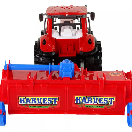 Raudonas traktorius su plūgu, frikcinis variklis