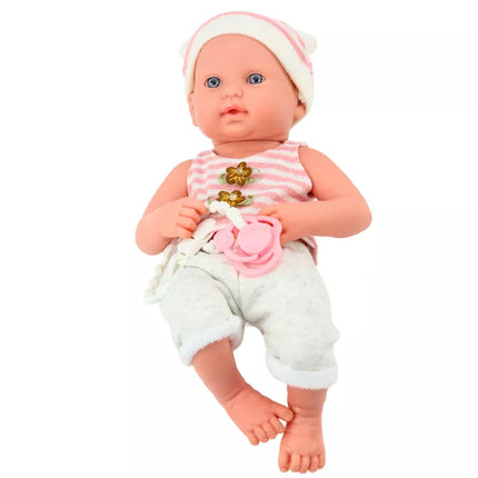 Lėlė su baltais ir rožiniais drabužiais, kepure, čiulptuku ir antklode