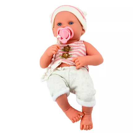 Lėlė su baltais ir rožiniais drabužiais, kepure, čiulptuku ir antklode