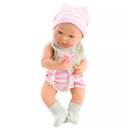 Lėlytė su baltais ir rožiniais drabužėliais, kepuryte, čiulptuku, seilinuku, antklode