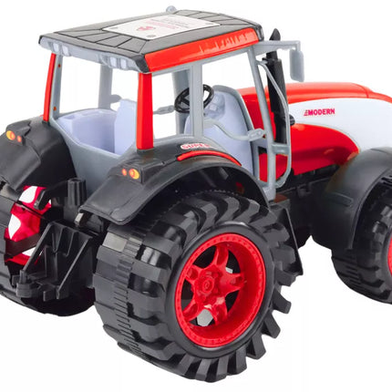 Didelis raudonas žemės ūkio traktorius