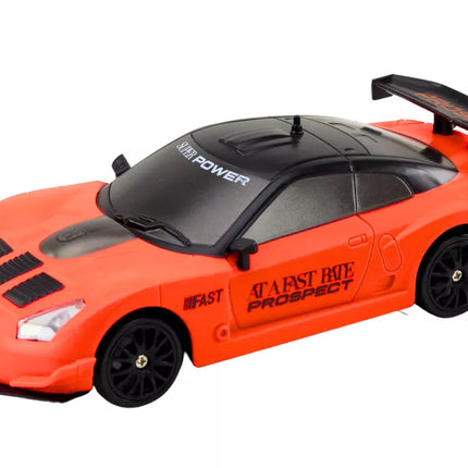 Nuotoliniu būdu valdomas R/C sportinis automobilis 1:24 oranžinis su keičiamais ratais