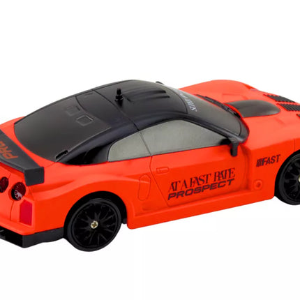 Nuotoliniu būdu valdomas R/C sportinis automobilis 1:24 oranžinis su keičiamais ratais