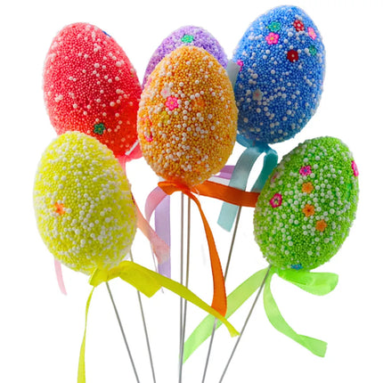 Velykiniai kiaušiniai ant vielos, marginti spalvingais baltais raštais, dekoruoti kaspinu, 6 vnt.