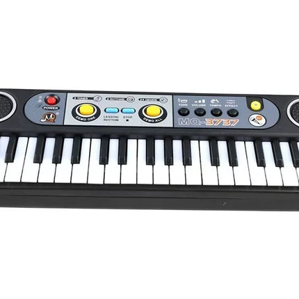 Elektrinis klavišinis instrumentas su mikrofonu