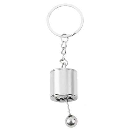 Metalinis raktų pakabukas su judančia pavarų dėžės imitacija, sidabrinis