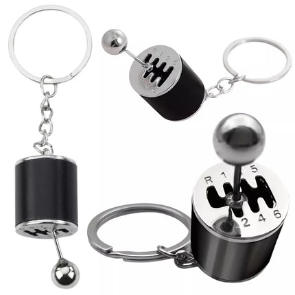 Metalinis raktų pakabukas su judančia pavarų dėže, juodas