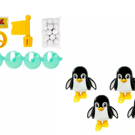 Pingvinas spardo kamuolį į ledkalnį