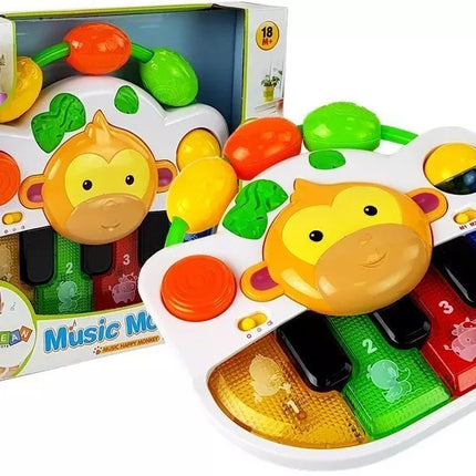 Pianinas su beždžionėle kūdikiui. Garsas ir šviesa