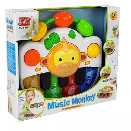 Pianinas su beždžionėle kūdikiui. Garsas ir šviesa