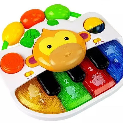 Pianinas su beždžionėle kūdikiui. Garsas ir šviesa