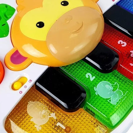 Pianinas su beždžionėle kūdikiui. Garsas ir šviesa