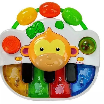 Pianinas su beždžionėle kūdikiui. Garsas ir šviesa