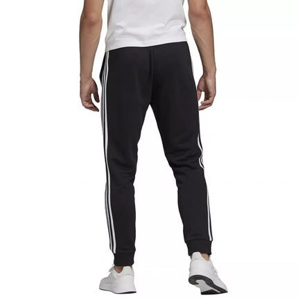 adidas Essentials Tapered Cuff 3 Stripes M GK8831 kelnės