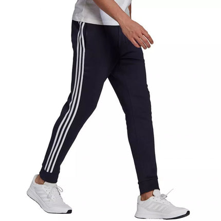 Adidas Essentials Flisinės kelnės su 3 juostomis ir siaurėjančiais galais M GK8823