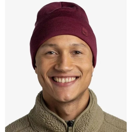 Kepurė BUFF suaugusiems, storo merino vilnos audinio, laisvo kirpimo, vienspalvė Tibeto raudonumo.